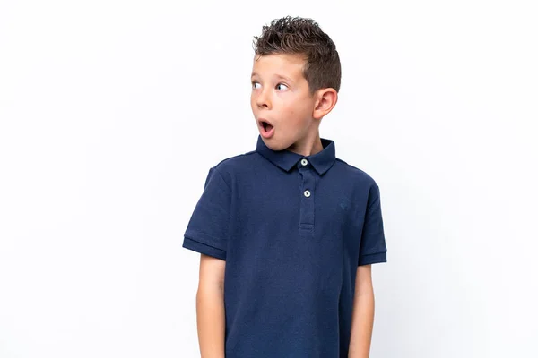 Little Caucasian Boy Isolated White Background Doing Surprise Gesture While — стоковое фото