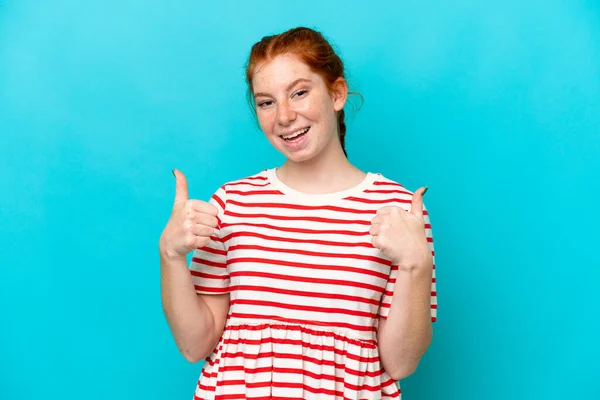 Young Reddish Woman Isolated Blue Background Giving Thumbs Gesture — ストック写真