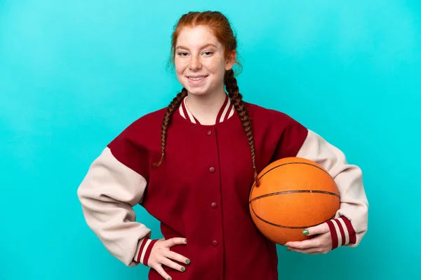 Young Reddish Woman Playing Basketball Isolated Blue Background Posing Arms —  Fotos de Stock