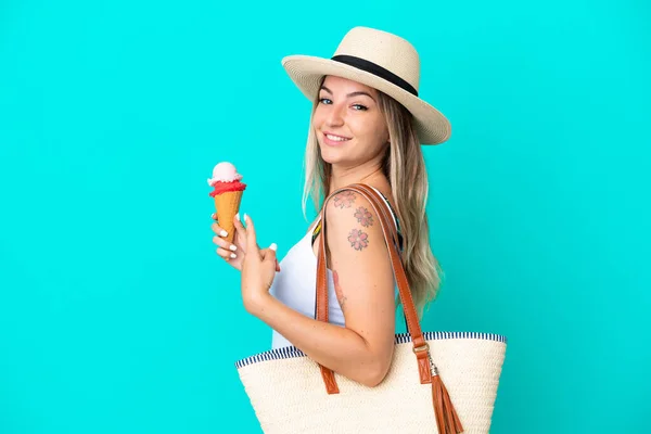 Young Romanian Woman Holding Ice Cream Beach Bag Isolated Blue — стокове фото