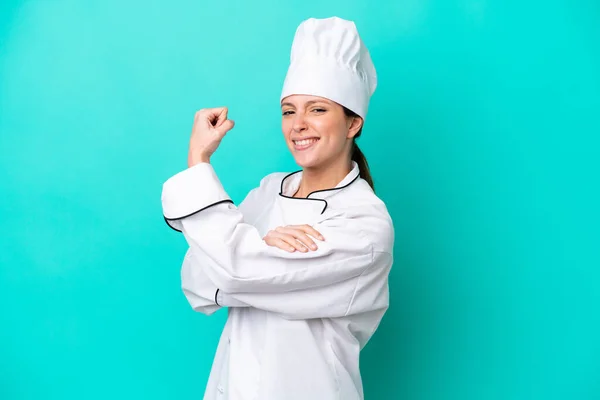 Young Caucasian Chef Woman Isolated Blue Background Doing Strong Gesture — Foto Stock