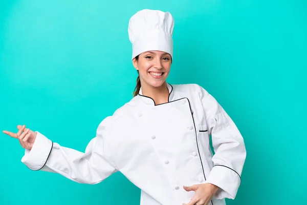 Young Caucasian Chef Woman Isolated Blue Background Making Guitar Gesture — Stock Photo, Image