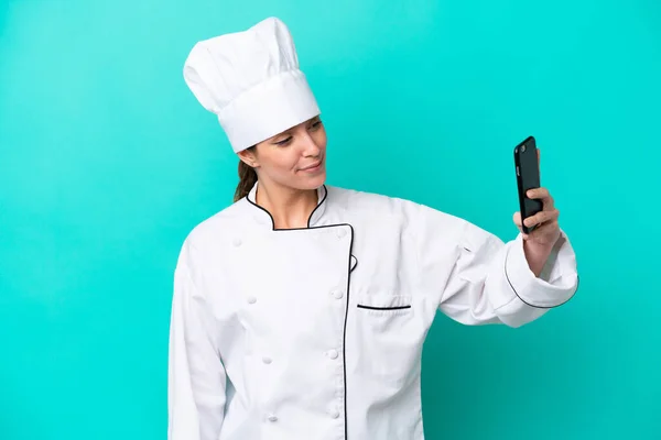 Young Caucasian Chef Woman Isolated Blue Background Making Selfie —  Fotos de Stock