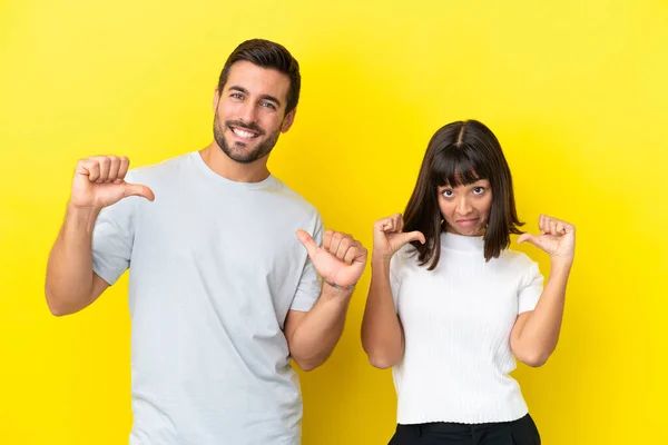 Young Couple Isolated Yellow Background Proud Self Satisfied Love Yourself — Stockfoto