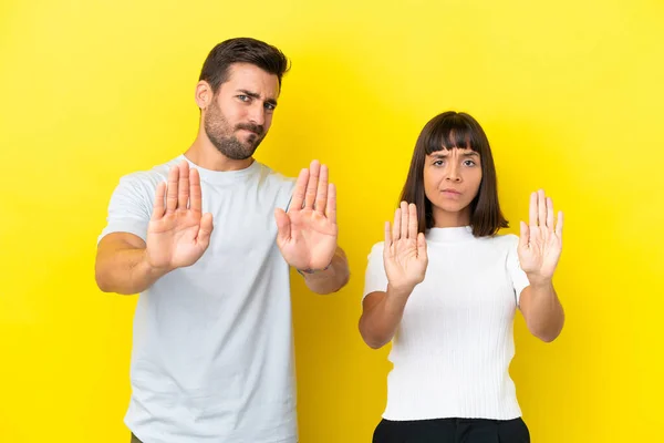 Young Couple Isolated Yellow Background Making Stop Gesture Disappointed Opinion — ストック写真
