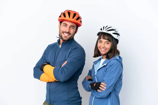 Young Cyclist Couple Isolated White Background Keeping Arms Crossed Lateral — Stock Fotó