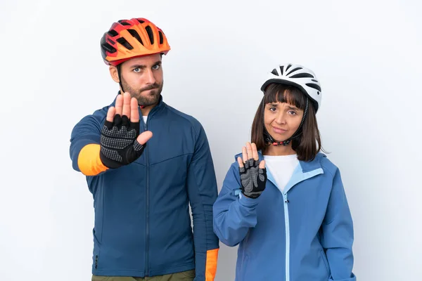 Young Cyclist Couple Isolated White Background Making Stop Gesture Denying — Stock Fotó