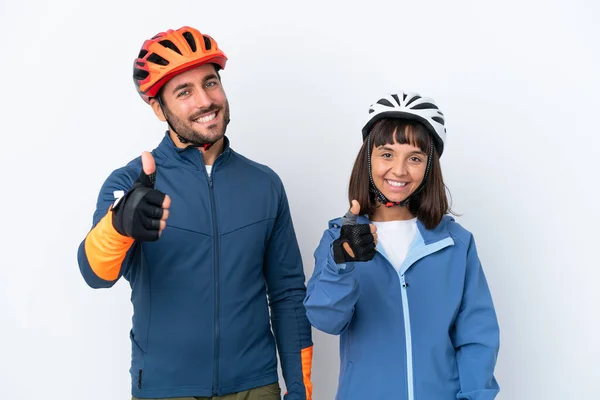 Young Cyclist Couple Isolated White Background Giving Thumbs Gesture Because — Stock Fotó