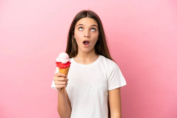 Little Girl Cornet Ice Cream Isolated Pink Background Looking Surprised — Stockfoto