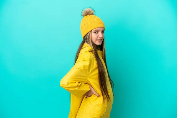 Little Girl Wearing Rainproof Coat Isolated Blue Background Suffering Backache — Foto Stock