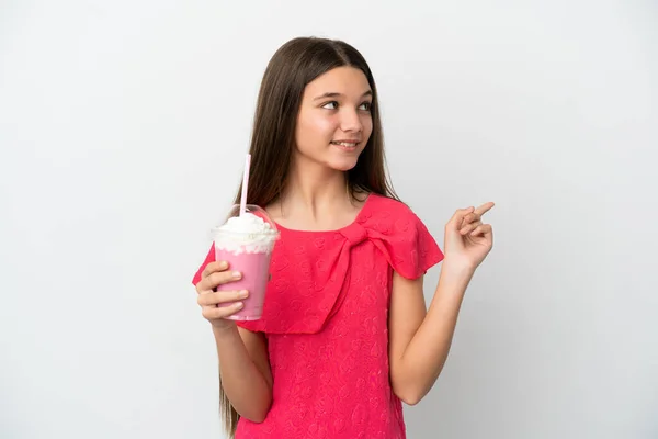 Little Girl Strawberry Milkshake Isolated White Background Pointing Great Idea — Stockfoto