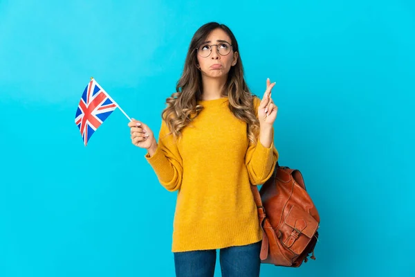 Young Hispanic Woman Holding United Kingdom Flag Isolated Blue Background — стоковое фото