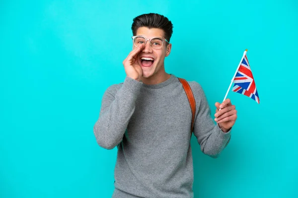 Young Caucasian Man Holding United Kingdom Flag Isolated Blue Background — 스톡 사진