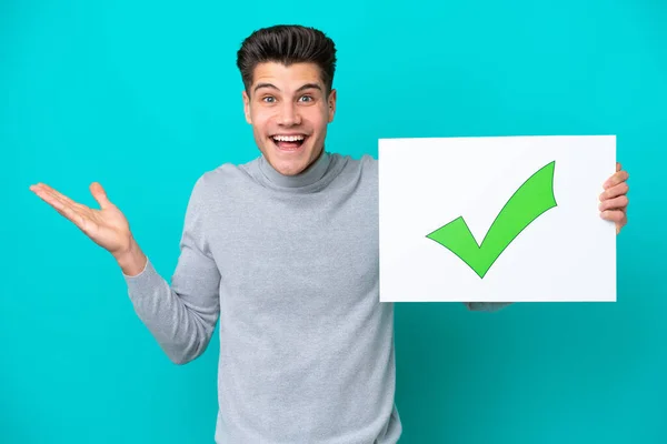 Young Handsome Caucasian Man Isolated Blue Bakcground Holding Placard Text — Stock Fotó