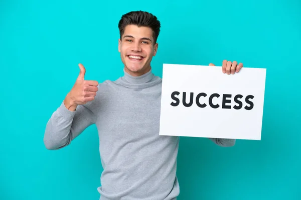 Young Handsome Caucasian Man Isolated Blue Bakcground Holding Placard Text — Stock Fotó