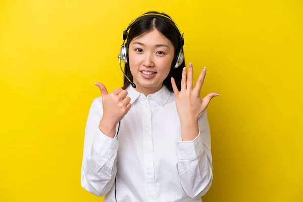 Telemarketer Chinese Woman Working Headset Isolated Yellow Background Counting Six — Foto de Stock