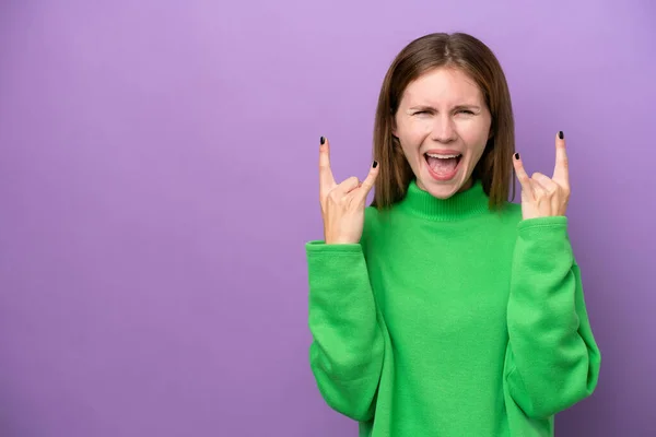 Young English Woman Isolated Purple Background Making Horn Gesture — Stockfoto