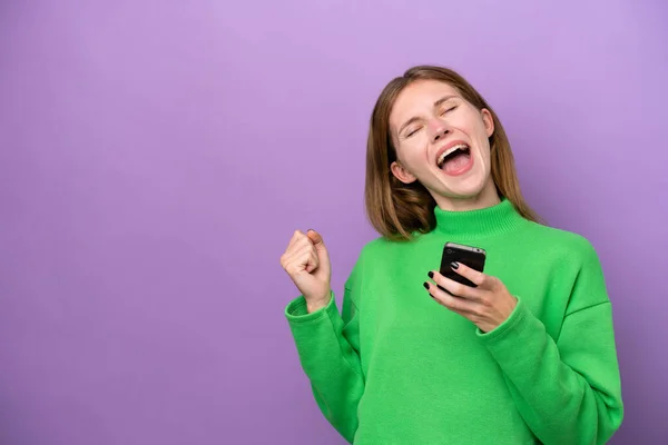 Young English Woman Isolated Purple Background Phone Victory Position — Φωτογραφία Αρχείου
