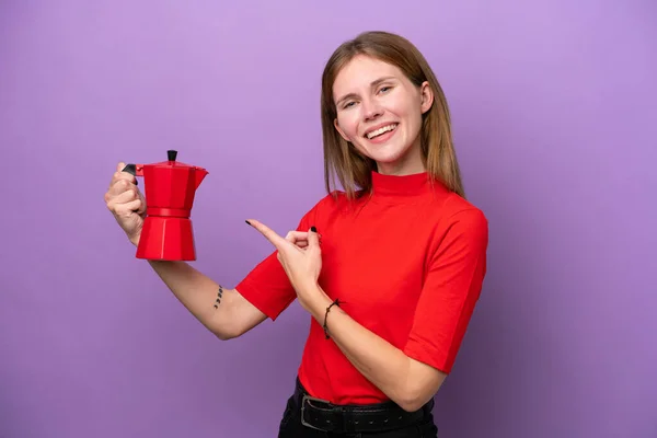 Young English Woman Holding Coffee Pot Isolated Purple Background Pointing — Photo