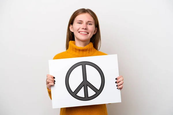 Młoda Angielka Odizolowana Białym Tle Tabliczką Symbolem Pokoju Szczęśliwym Wyrazem — Zdjęcie stockowe