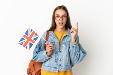Young hispanic woman holding an United Kingdom flag over isolated white background thinking an idea pointing the finger up