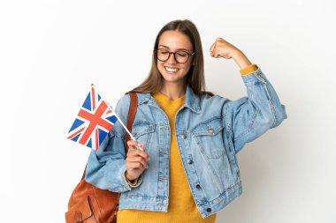 Young hispanic woman holding an United Kingdom flag over isolated white background doing strong gesture