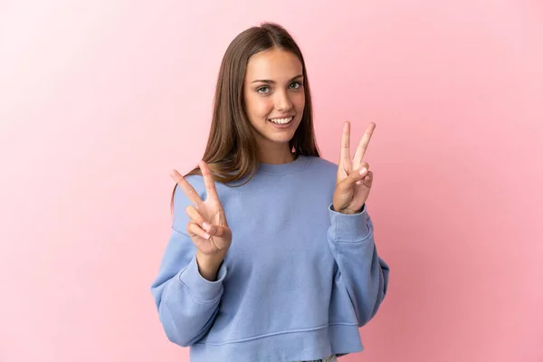 Mujer Joven Sobre Fondo Rosa Aislado Mostrando Signo Victoria Con — Foto de Stock