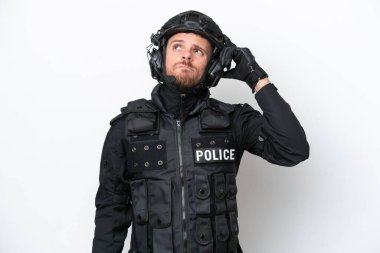 Brazilian soldier man isolated on white background having doubts and with confuse face expression