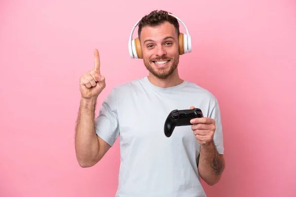 Young Brazilian Man Playing Video Game Controller Isolated Pink Background — Stockfoto
