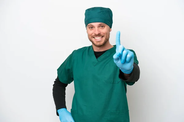Surgeon Brazilian Man Green Uniform Isolated White Background Showing Lifting — Φωτογραφία Αρχείου
