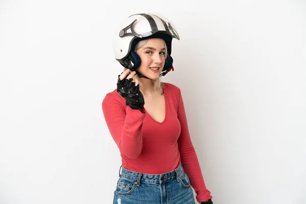 年轻的高加索女人 头戴摩托车头盔 背景与白人隔离 做着赚钱的姿势 — 图库照片