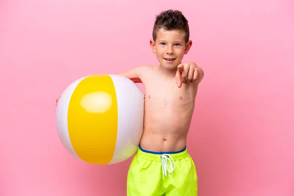 Little Caucasian Boy Holding Beach Ball Isolated Pink Background Points — 스톡 사진