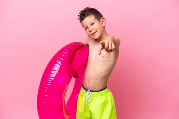 Little Caucasian Boy Holding Inflatable Donut Isolated Pink Background Pointing — Photo