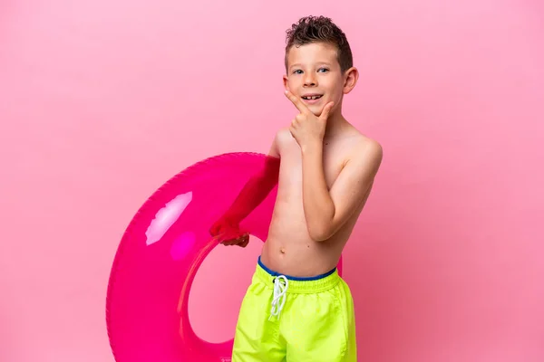 Little Caucasian Boy Holding Inflatable Donut Isolated Pink Background Happy —  Fotos de Stock