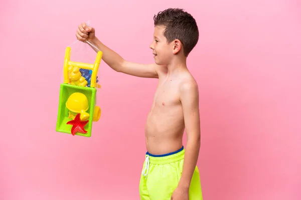 Little Caucasian Boy Holding Beach Toys Isolated Pink Background Happy — Fotografia de Stock