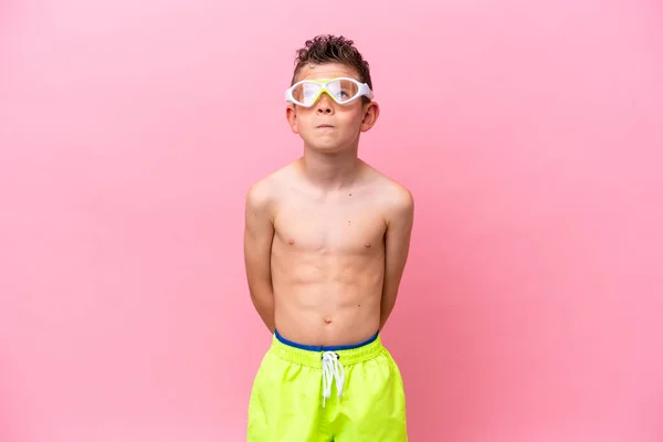 Little Caucasian Boy Wearing Diving Goggles Isolated Pink Background Looking — Stockfoto