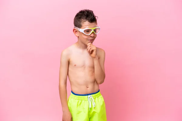 Little Caucasian Boy Wearing Diving Goggles Isolated Pink Background Looking — Photo