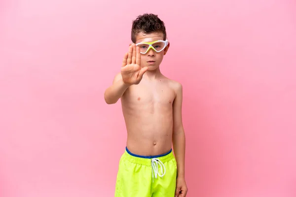 Little Caucasian Boy Wearing Diving Goggles Isolated Pink Background Making — Photo