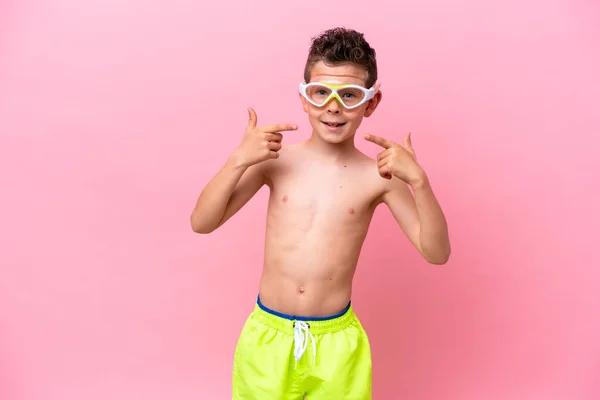 Little Caucasian Boy Wearing Diving Goggles Isolated Pink Background Giving — стоковое фото