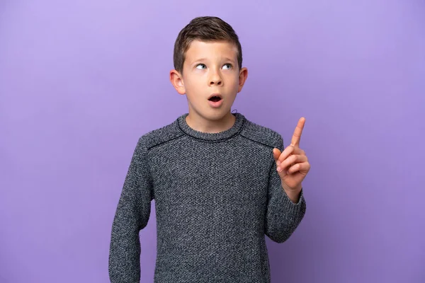 Little Boy Isolated Purple Background Thinking Idea Pointing Finger — Zdjęcie stockowe