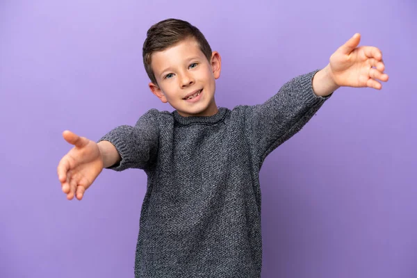 Little Boy Isolated Purple Background Presenting Inviting Come Hand —  Fotos de Stock