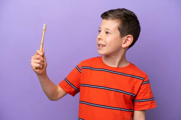 Little Boy Brushing Teeth Isolated Purple Background Happy Expression — Stock Photo, Image
