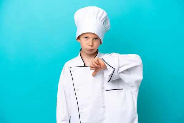 Little Chef Boy Isolated Blue Background Showing Thumb Negative Expression — Foto Stock
