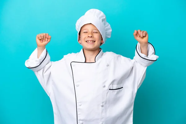 Little Chef Boy Isolated Blue Background Doing Strong Gesture — Foto de Stock