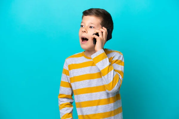 Little Boy Isolated Blue Background Keeping Conversation Mobile Phone Someone — Stock Photo, Image