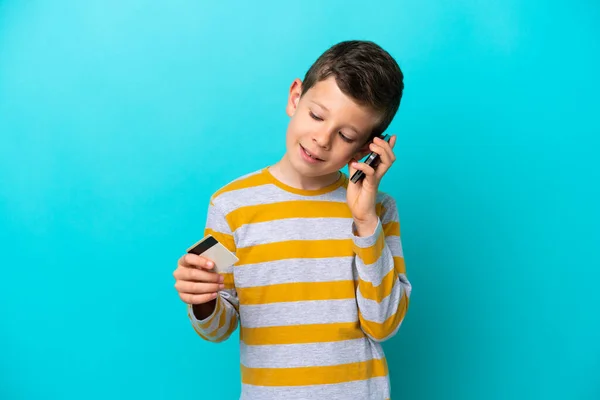 Little Boy Isolated Blue Background Keeping Conversation Mobile Phone Holding — Stock Photo, Image