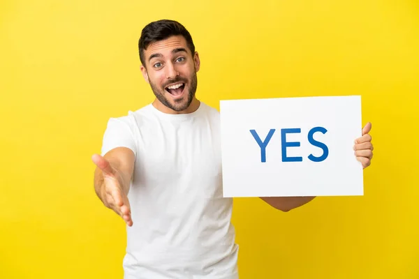 Young Handsome Caucasian Man Isolated Yellow Background Holding Placard Text — Photo