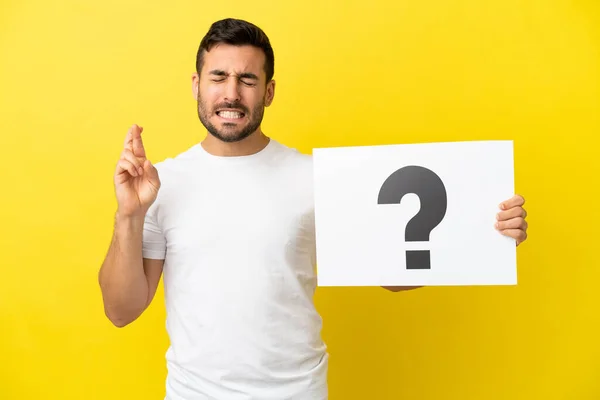 Young Handsome Caucasian Man Isolated Yellow Background Holding Placard Question — Stock fotografie