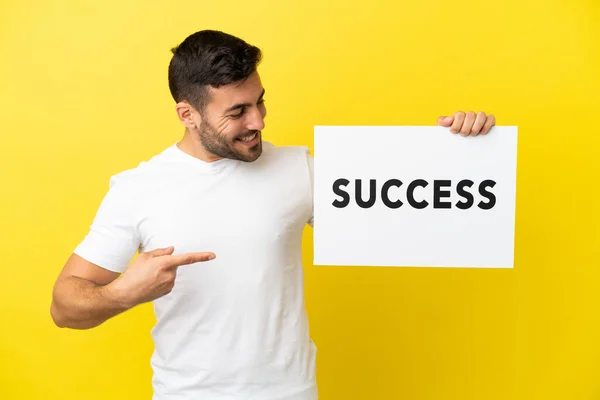 Young Handsome Caucasian Man Isolated Yellow Background Holding Placard Text — Stockfoto