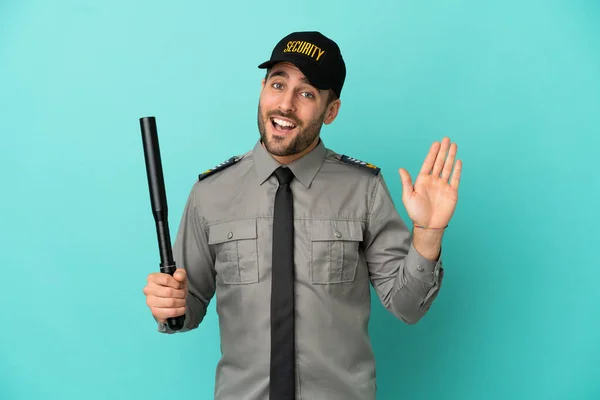 Young Security Man Isolated Blue Background Saluting Hand Happy Expression — Foto de Stock